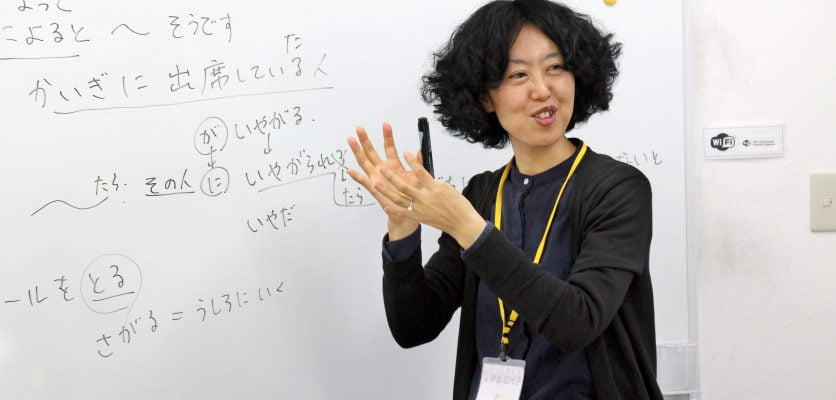 Japanese teacher teaching Japanese to the students