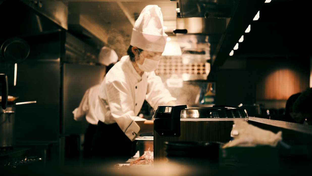 Japanese chef cooking in a restaurant.