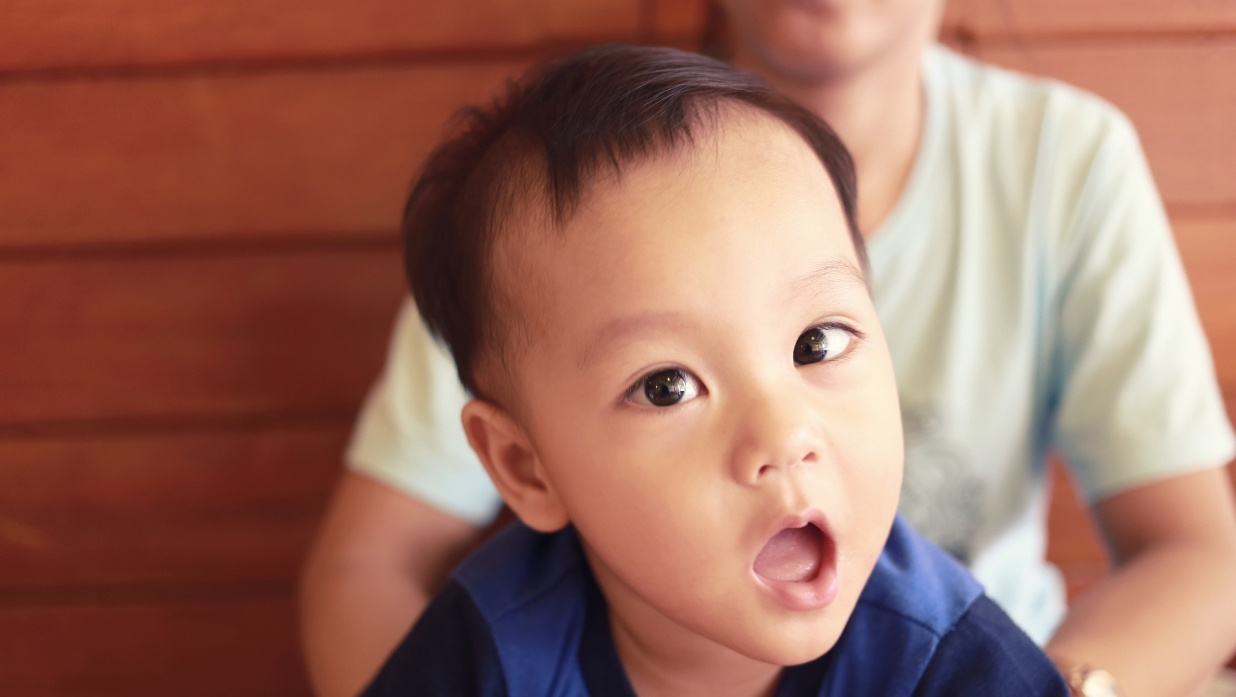 A child looking shocked at the camera.