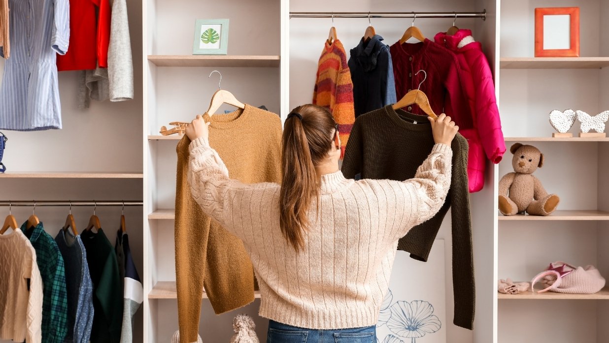 Woman looking at options for clothing.