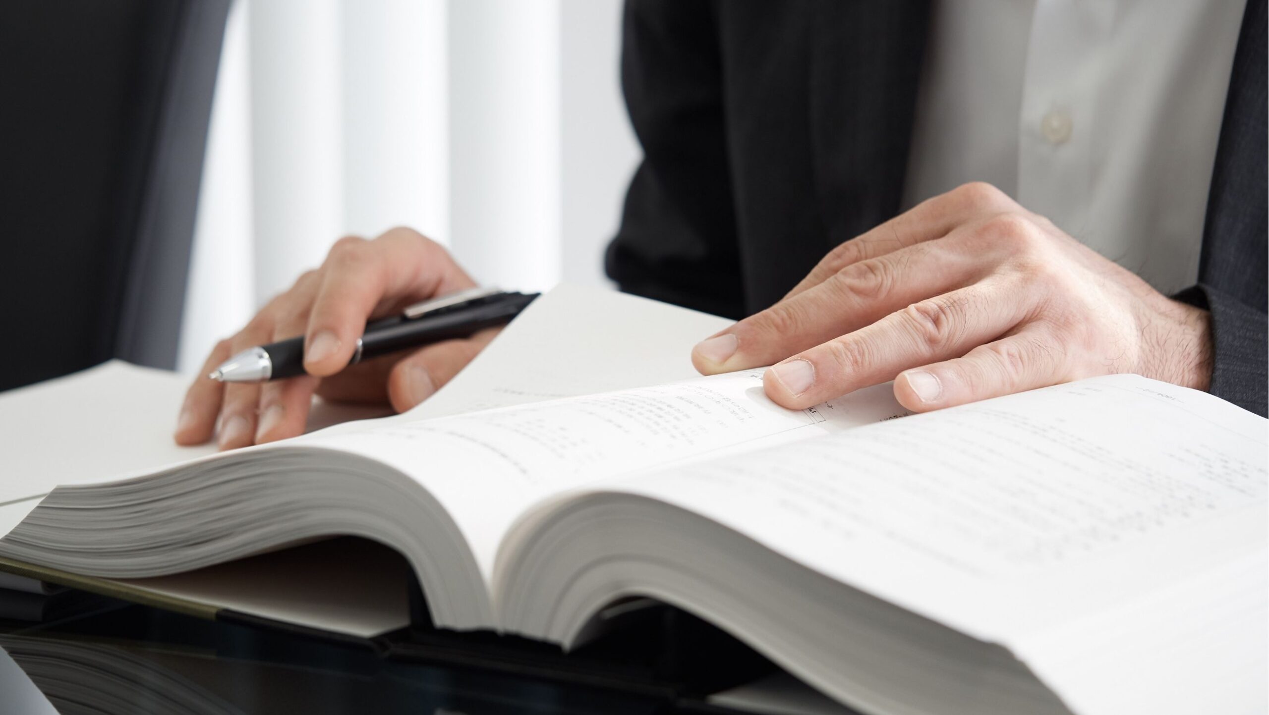 person studying a jlpt n2 textbook
