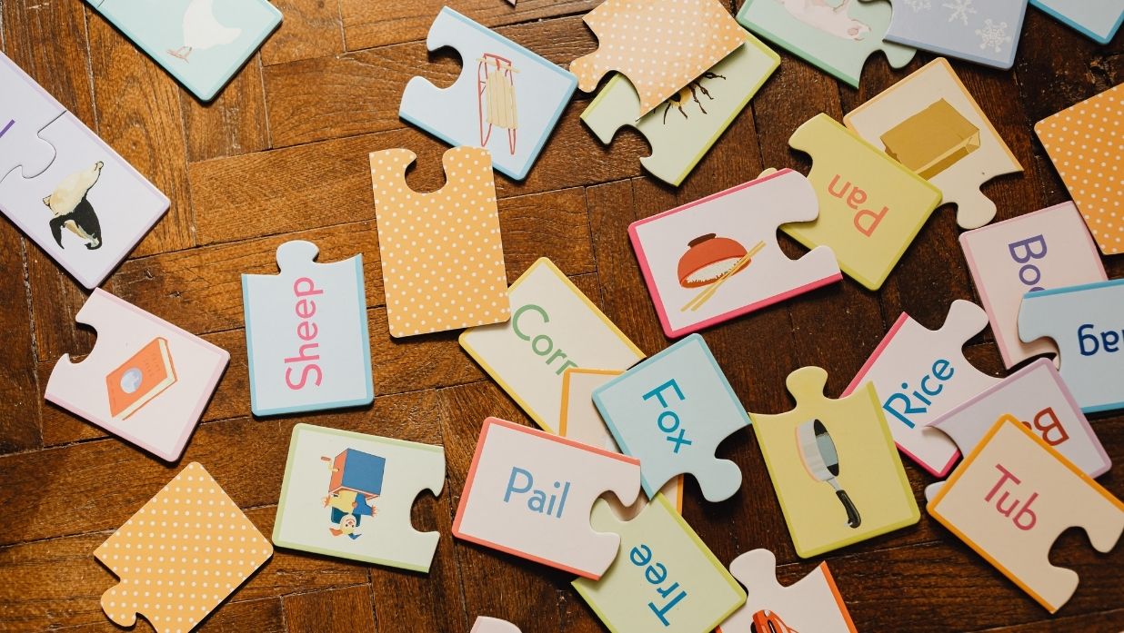 Picture of vocabulary puzzle pieces lying around.
