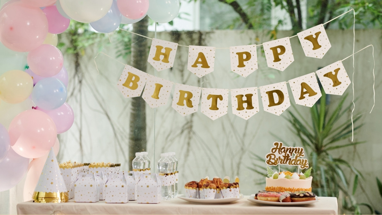 A birthday party with balloons and cake!