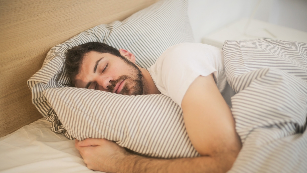 Man sleeping on bed