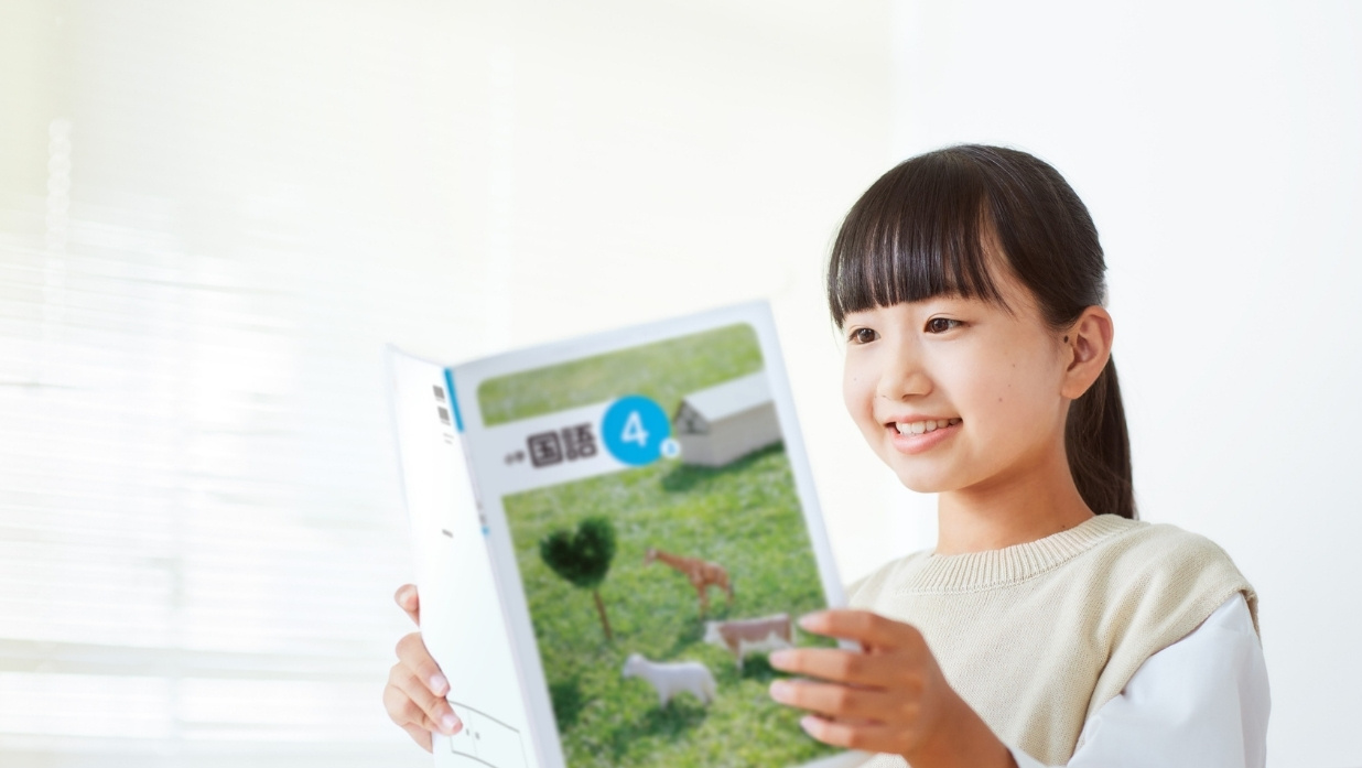 Girl reading a Japanese book