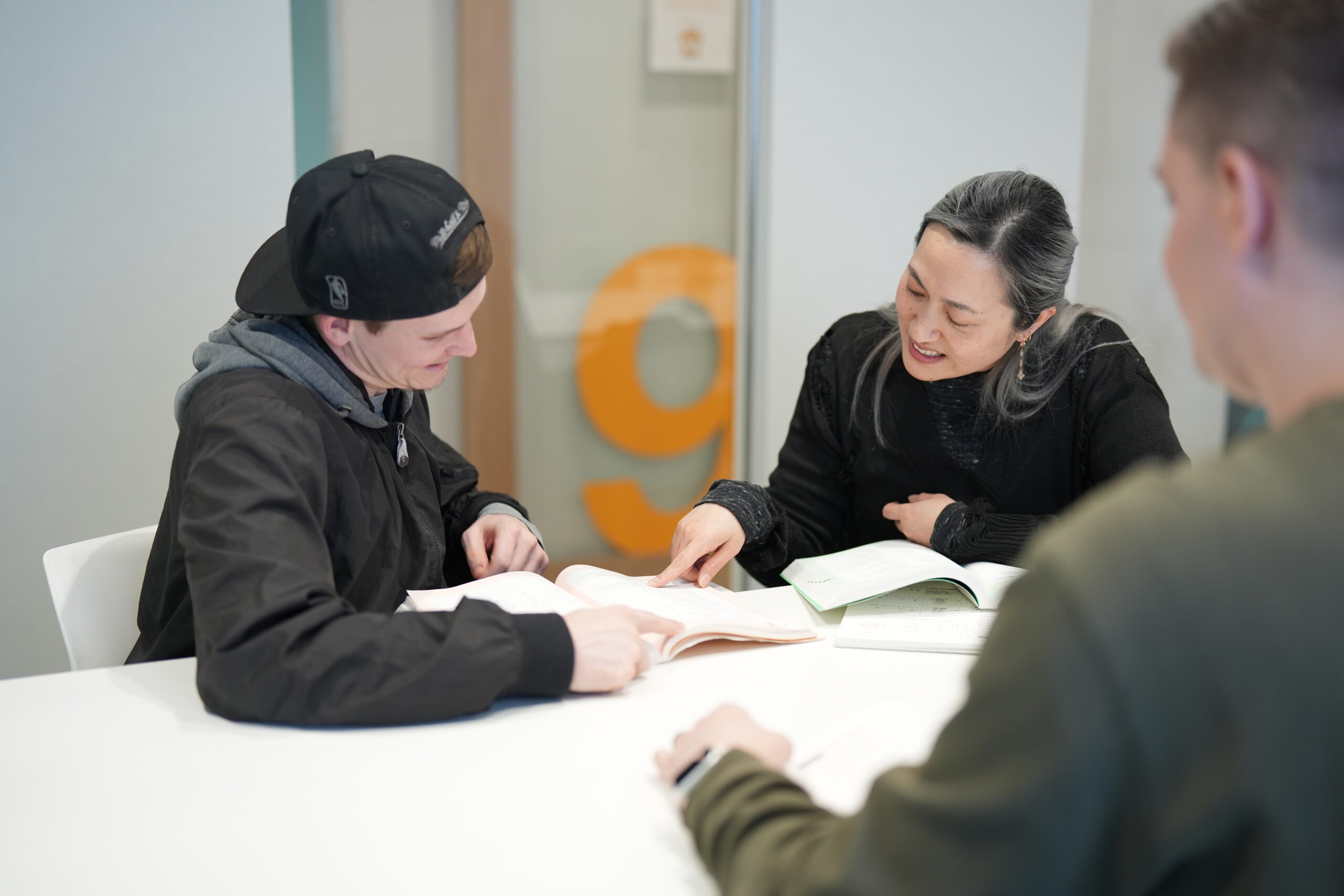 coto academy shibuya teacher talking to a student