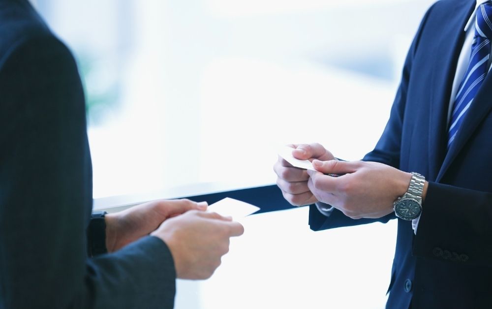 people exchanging business cards in japan
