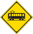 Japanese road sign showing a train crossing is ahead