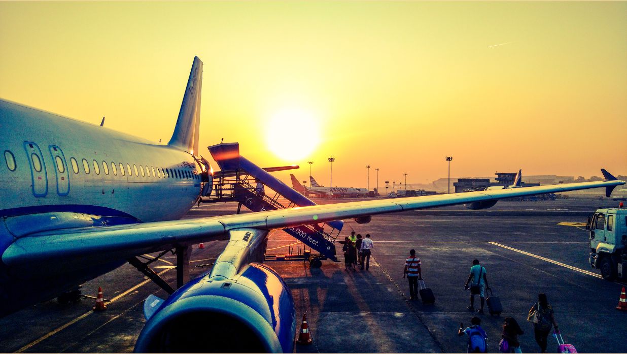 Image of an airplane taking off during the sunset in Tokyo