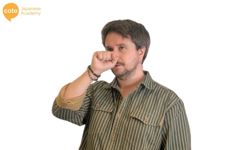 Japanese hand gesture that mimics the Tengu deity by putting your hand in front of your nose to imitate its long nose. Used for saying that someone is conceited